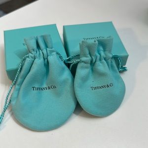 To Tiffany and Co. dust bags and two Tiffany and Co. jewelry boxes. Perfect